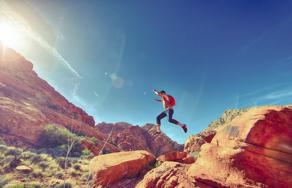 man, jumping, nature, mountains, rock formations, jump, joyful, happy, athletic, outdoors, fun, sport, hiking, rocks, national, park, sunlight, action, active